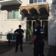 Montreal police on June 21, 2017, guard the front of the building where Amor Ftouhi, who is suspected of stabbing a Michigan airport police officer, lived before traveling to the U.S. earlier this month. (Julien Besset/AFP/Getty Images)